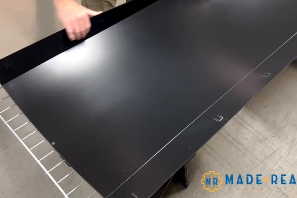 Folding the liner sidewall along its preformed hinge.